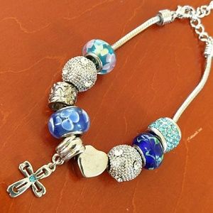 Beaded bracelet with cross charm